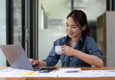 young-woman-using-laptop-while-working-for-business-financial-investment-.jpg